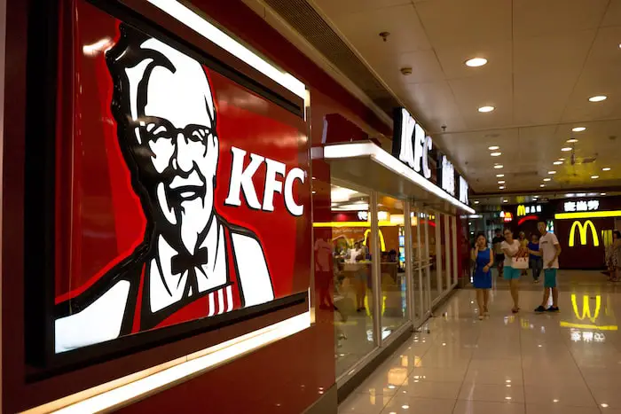 BEIJING, CHINA - 2014/07/22: A KFC restaurant in a shopping mall.  KFC, McDonald’s, Pizza Hut and other Western brands are suffering a food safety crises in the Chinese market. On July 20, 2014,  Shanghai Fuxi food Ltd. the meat supplier for well-known international fast food chains such as McDonald’s and Yum Group, was exposed for using expired and bad chicken and beef. (Photo by Zhang Peng/LightRocket via Getty Images)